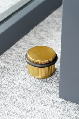 Arpa Gold golvdörrstoppare